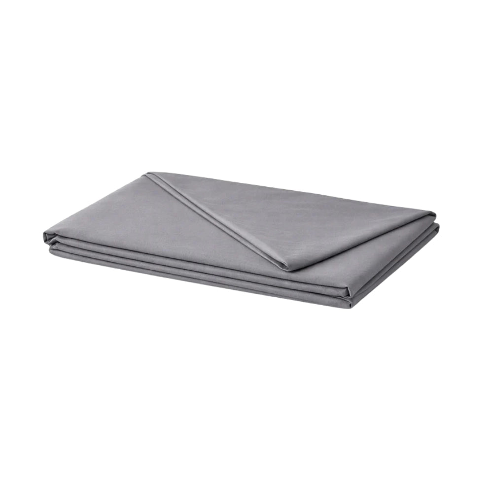 grey pillow folded on white surface for full body support