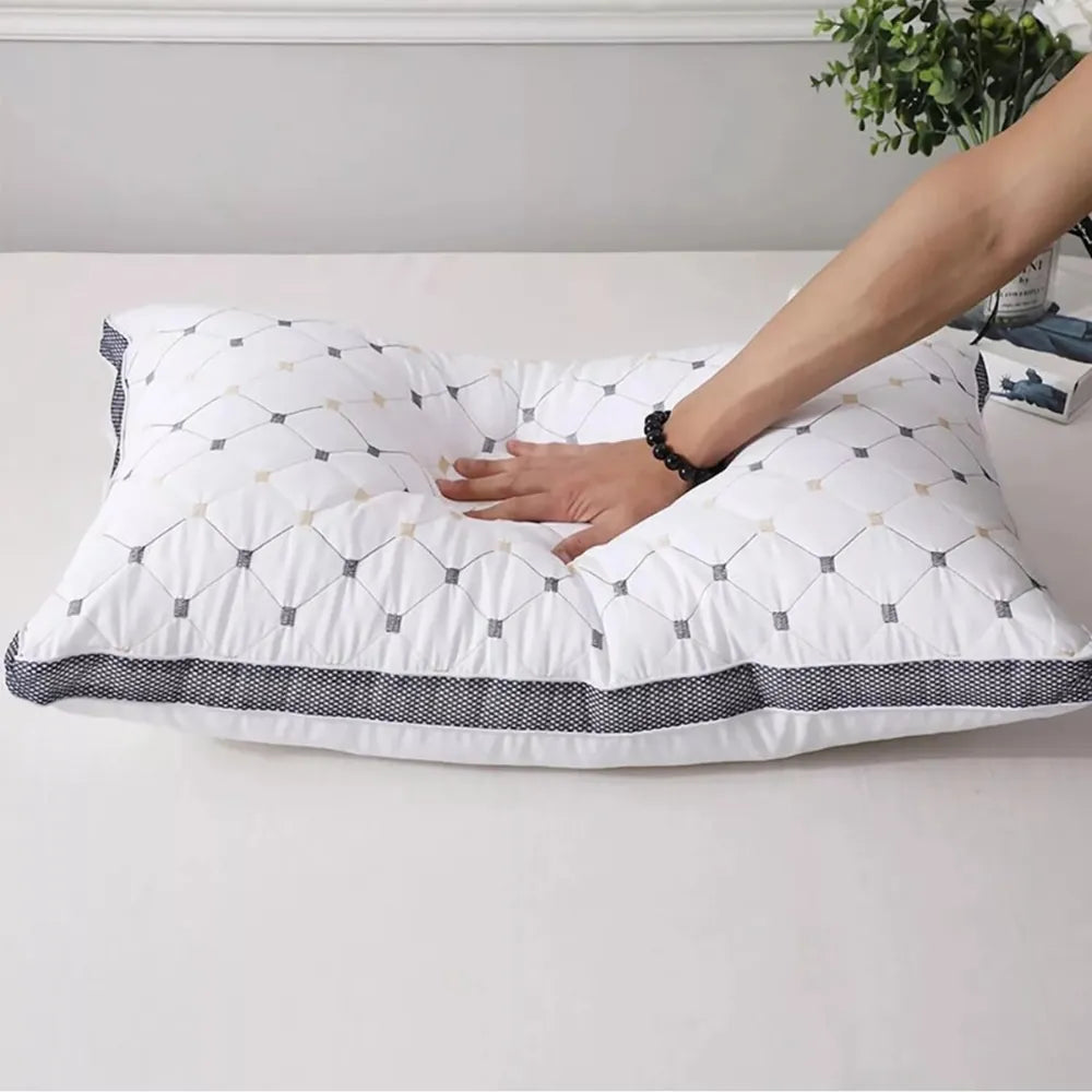 Hand pressing DreamHaven pillow with Made in Australia showing soft hotel comfort