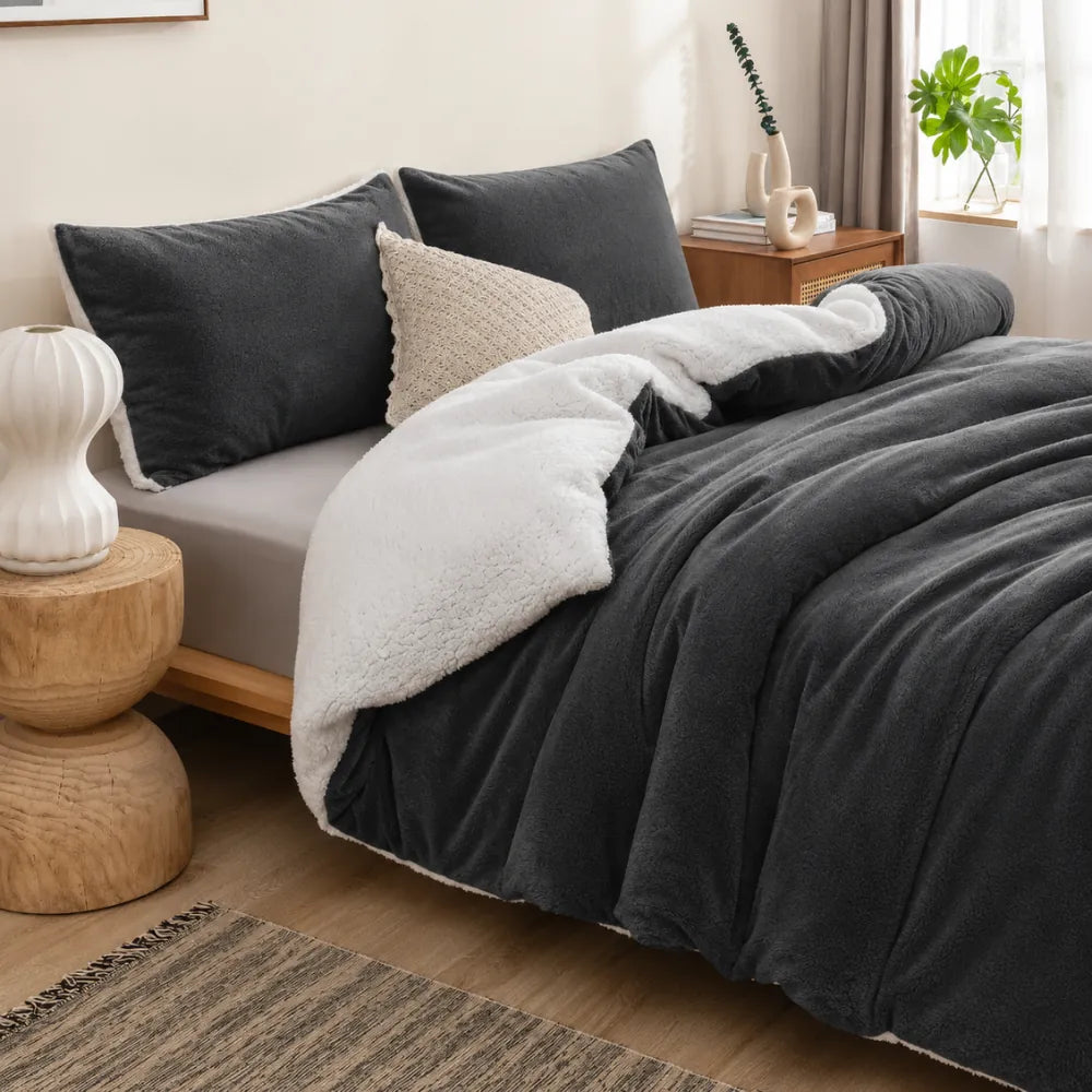 Charcoal grey sherpa quilt cover styled in a modern bedroom