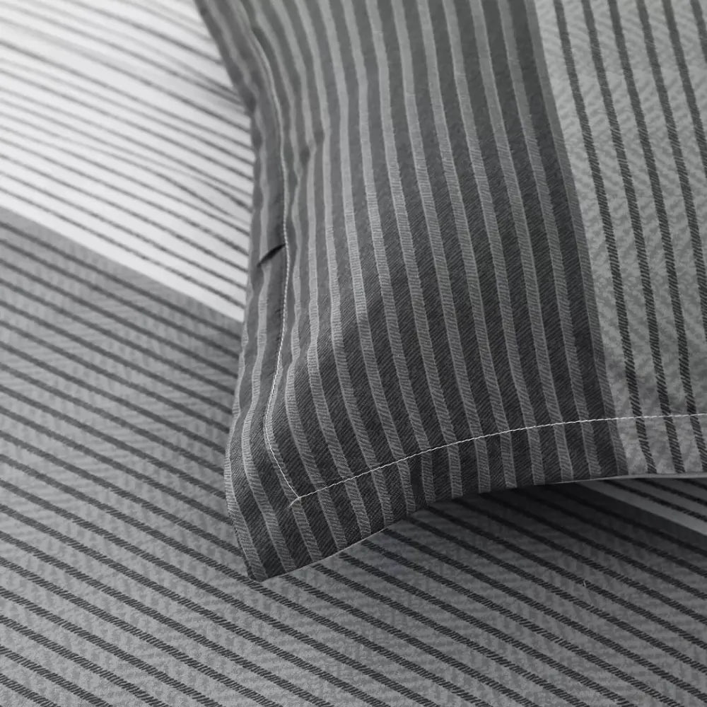 Close-up of grey striped pillowcase from a summer comforter set