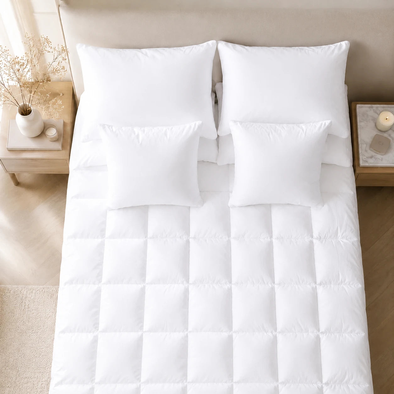 Top-down view of a fitted bamboo mattress topper with matching pillows.