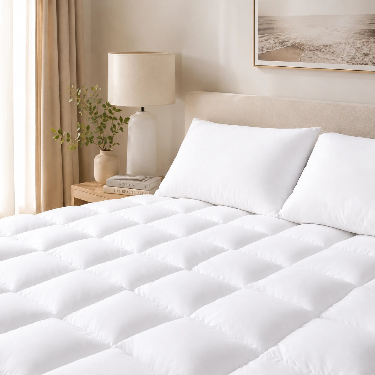Bamboo mattress topper styled on a luxury bed in a bright Australian bedroom.