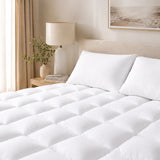 Bamboo mattress topper styled on a luxury bed in a bright Australian bedroom.