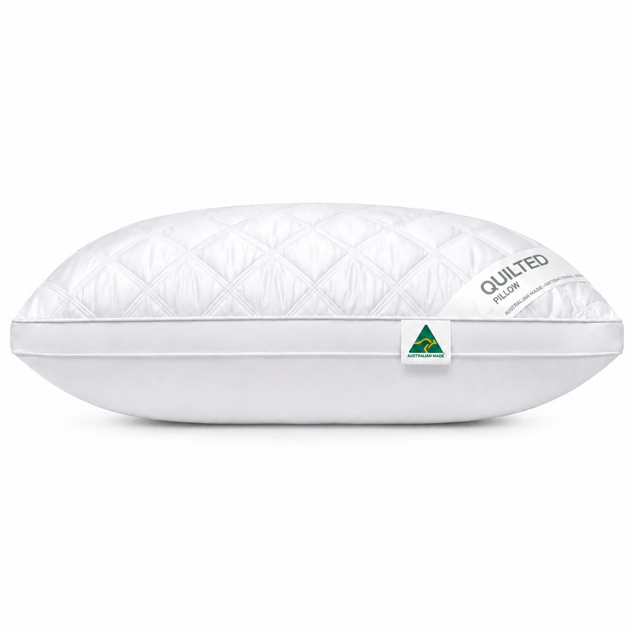 White quilted pillow with Australian made tag on clean background