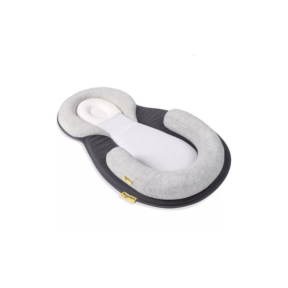 Pebble Grey baby head shaping pillow designed to prevent flat head syndrome and support healthy infant development during rest.