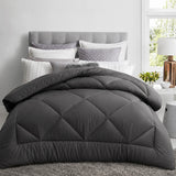 Charcoal quilt on a bed creating a comfortable all-season sleep space