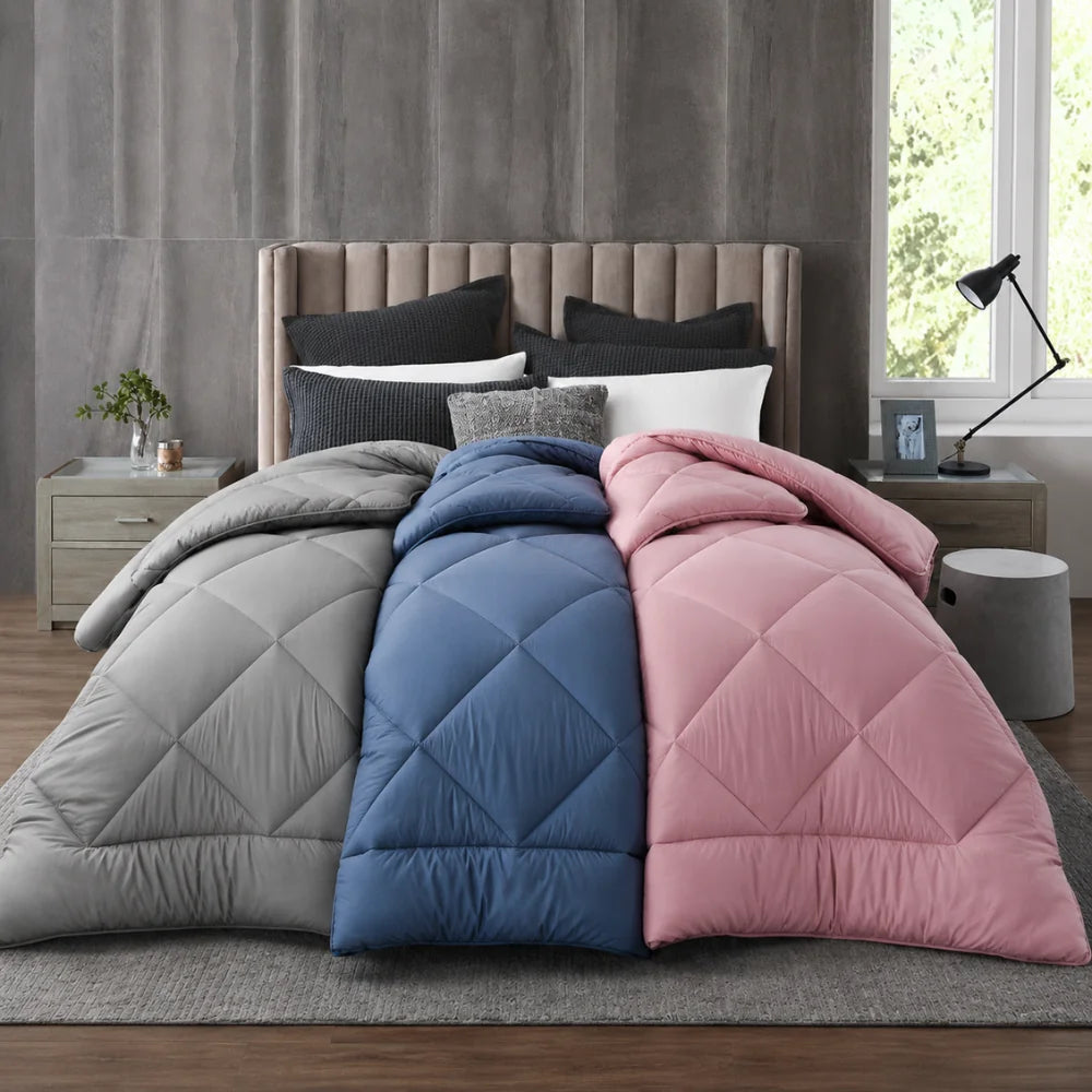 Grey blue and pink quilts displayed together showcasing bamboo bedding