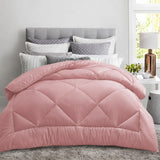 Pink quilt neatly arranged on a bright bed with bamboo comfort