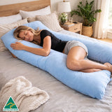 woman resting on blue pillow for comfortable side sleep