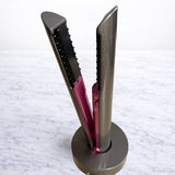 Closeup of hair straightener docked securely in the charging base