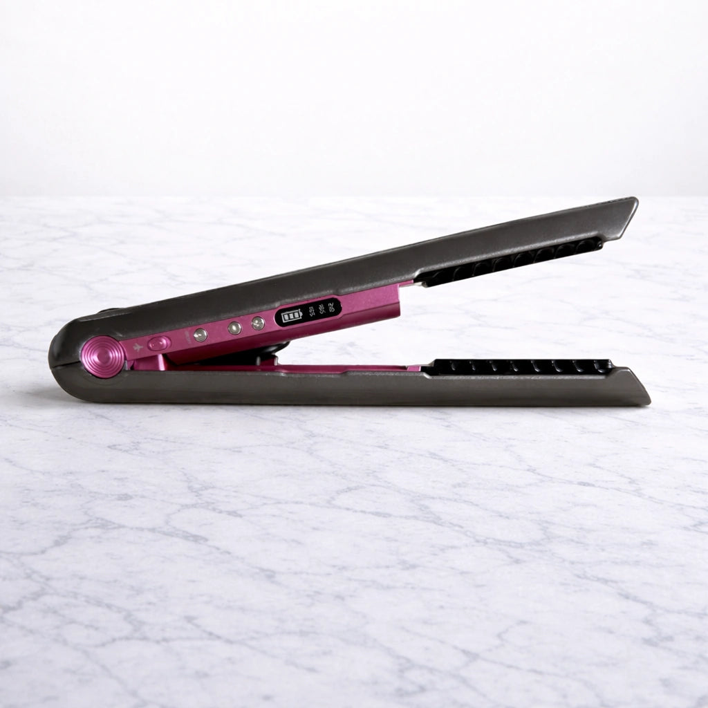 Cordless hair straightener resting on marble bench for easy travel styling
