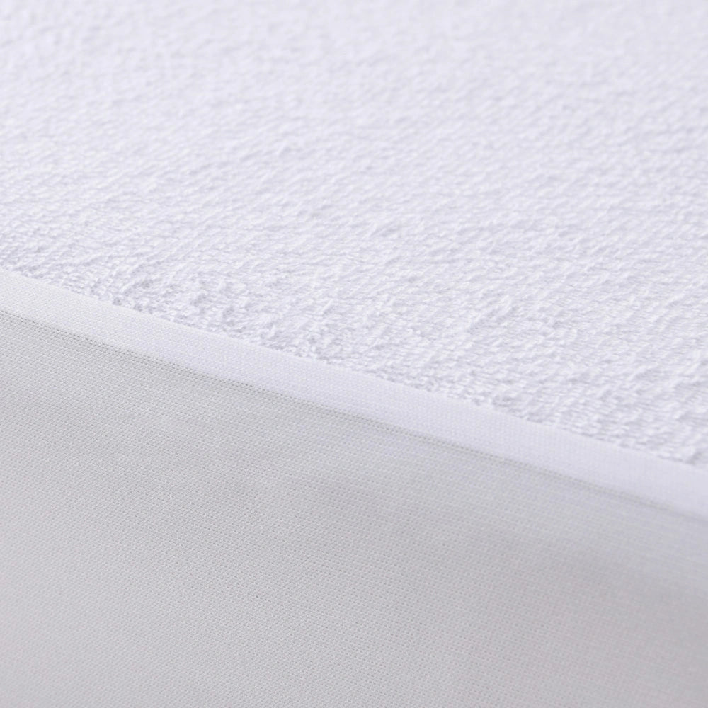Close-up of the soft cotton terry mattress protector surface
