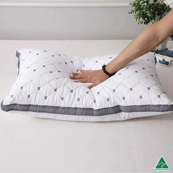 Hand pressing DreamHaven luxury pillow with Made in Australia badge showing hotel-grade softness and trusted local quality