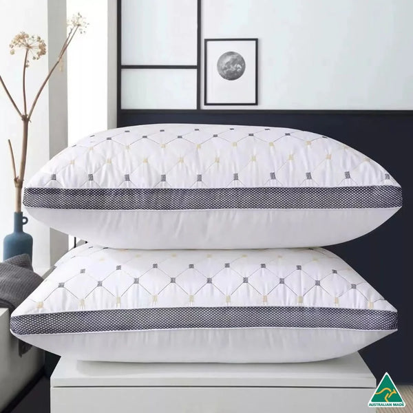 Two DreamHaven pillows styled on bed for luxury hotel-room feel