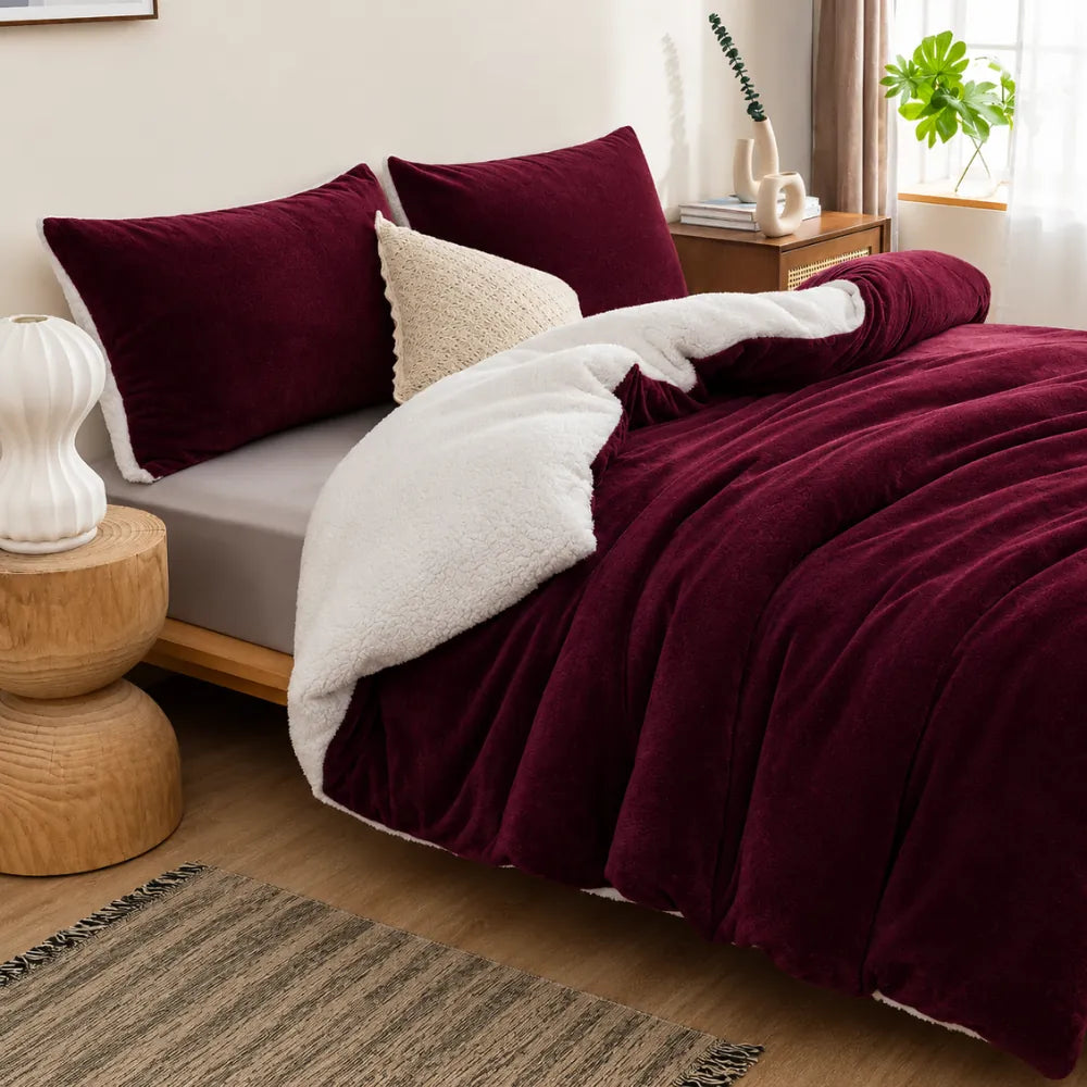 Burgundy sherpa quilt cover styled on a warm winter bed