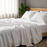 White hotel quality bed sheets styled on luxury bed