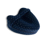 Dark blue pillow positioned for side sleeping and hip alignment support
