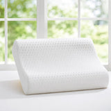 Latex contour pillow displayed in a bright bedroom setting