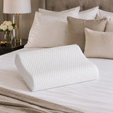 Latex contour pillow positioned on bed for comfortable sleep