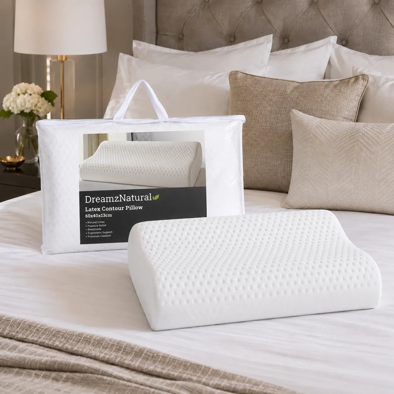Natural latex pillow with carry bag displayed on a luxury bed