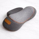 Ergonomic pillow resting on marble surface for daily neck massager comfort