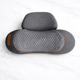 Support pillow laid flat on marble bench for heated neck massager comfort