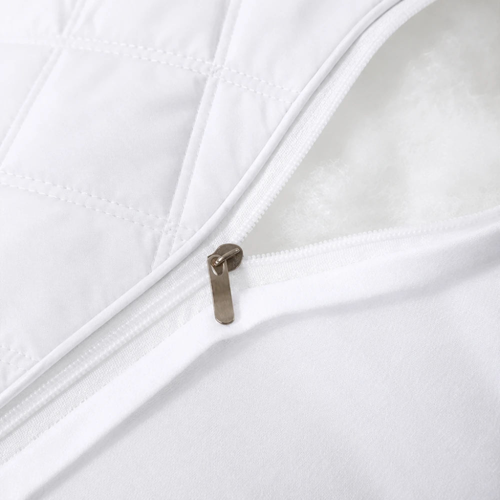 Close-up zipper opening showing removable quilted pillow cover