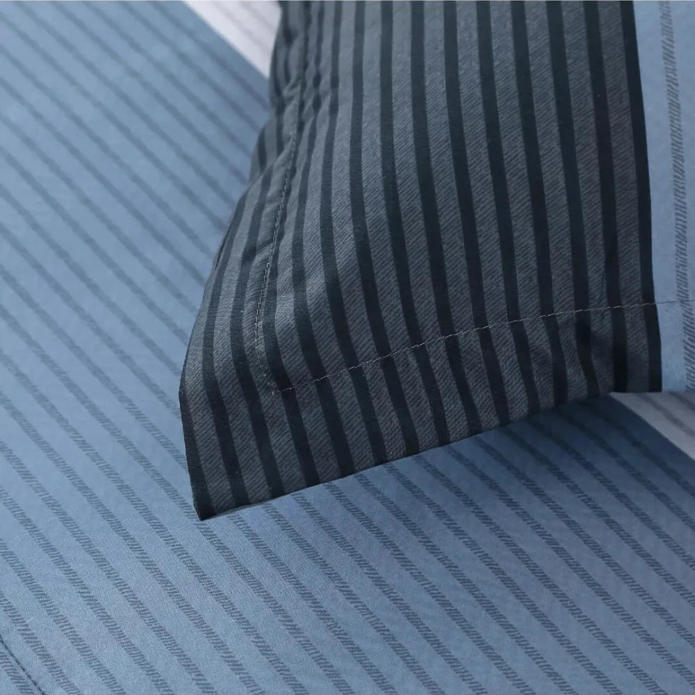 Close-up of blue striped pillowcase from a summer comforter set
