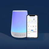 Modern baby white noise machine with app interface showing light, sound, and scene control options.